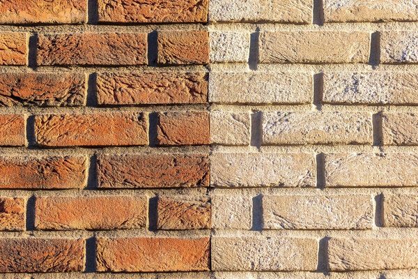 Brick pattern divided in half into beige and brick color Usable as a pattern, base or background for graphic purposes