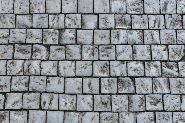 Stone granite cube surface, retro pavement pattern Usable as a pattern, base or background for graphic purposes