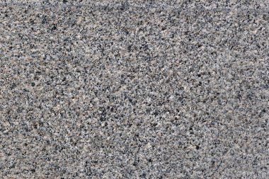 Daha fazla grafik çalışması için gri arkaplan veya dokudan oluşan kabaca bir yüzey malzemesinden yapılmış bir duvar