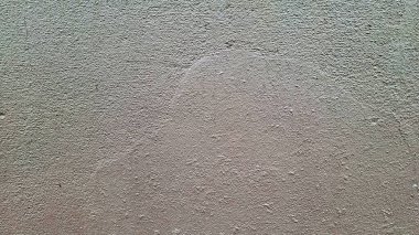 İnce, pürüzlü bir sonu olan desenli bir duvar yüzeyi. Rengi soluk bir bej, ton çeşitliliğiyle doğal ve organik bir his yaratıyor. Özgeçmiş veya soyut tasarımlar için ideal.