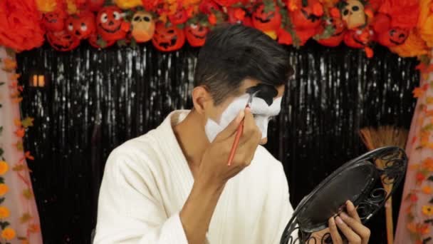 Brown Skinned Boy Bathrobe Putting Makeup Halloween Party Scary Decoration — Stock Video