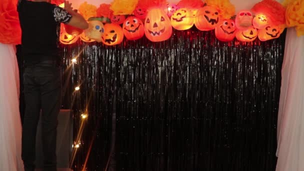 Making Scary Halloween Decoration Pumpkin Candy Buckets Lights Treat Trick — Stock Video