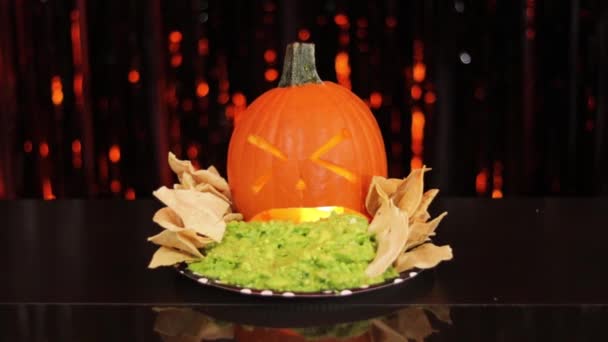 Scary Pumpkin Spewing Guacamole Food Halloween Party Plate Nachos Looks — Stock Video