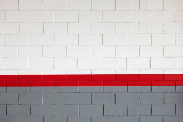 白と灰色の塗料で着色されたレンガの壁のテクスチャの背景中央に直線明るい赤線 — ストック写真