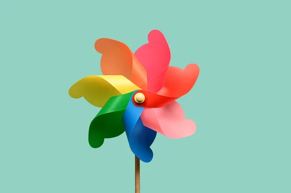 Bright Paper Pinwheel Multicolored Curls Thin Stick Isolated Light Blue — Stock Photo, Image