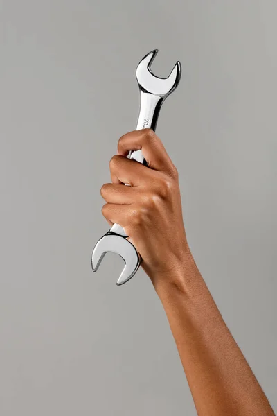 Anonymous African American Female Demonstrating Metal Spanner Raised Arm Gray — Stock Photo, Image