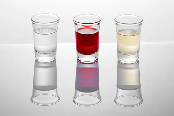 Shot Glasses Red White Transparent Alcoholic Drinks Reflecting Surface Studio — Stock Photo, Image