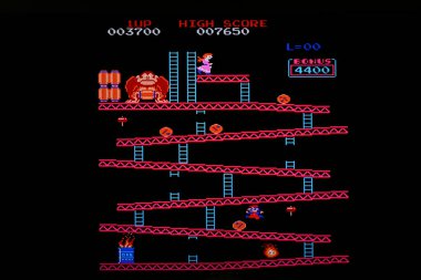 Retro arcade game displaying a level of donkey kong, showing the classic 8 bit graphics and gameplay clipart