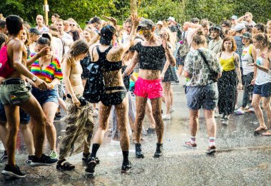 Berlin, Germany, 27 july, 2019. Bright 41th Berlin Pride street festival. Smartly dressed people with posters, calls for freedom and tolerance clipart