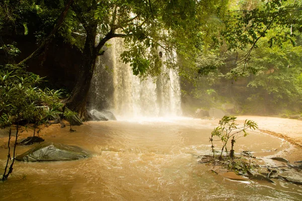 Green waterfall in the African jungle, very deep. Beautiful calm landscape in Kenya