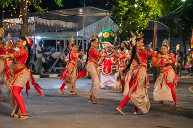 Colombo, Sri Lanka. 06 febfuary 2023. large carnival festive procession with elephants and dancers in bright national costumes through the streets of Colombo