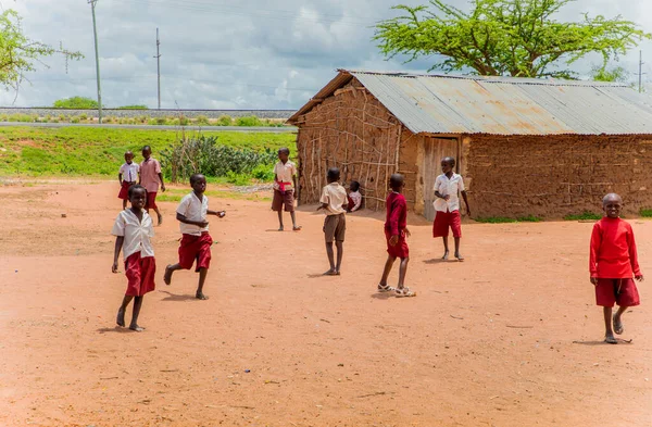 stock image Diani, Mombasa, 17 oktober 2019, Africa, Kenya. African children in the maasai village playing soccer near the school