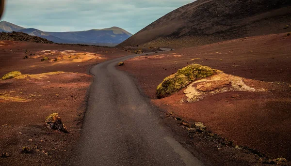 stock image Amazing panoramic landscape of volcano in Timanfaya national park. Popular touristic in Lanzarote island Canary islans Spain. Artistic picture. Travel concept.