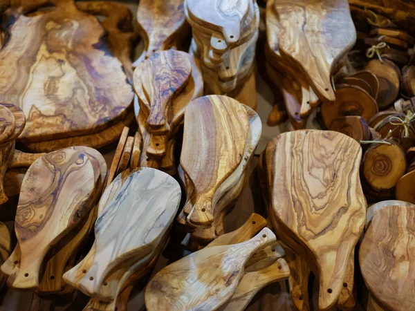 Olive wood products for sale.Kitchen boards and mortars. Wood concept.