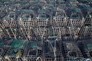 Pile of crab and lobster cages in Portugal . Seafood concept. clipart