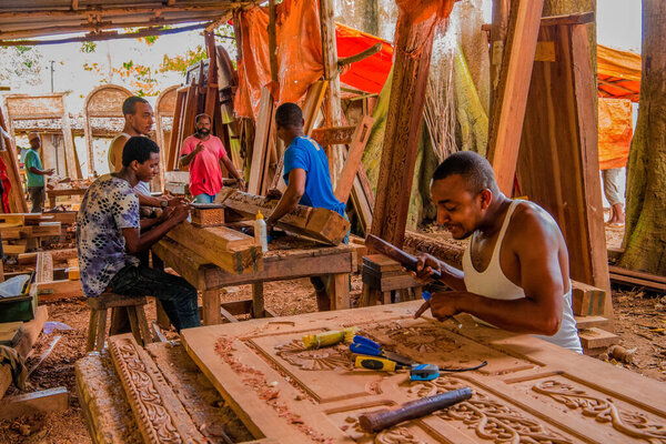 Stone Town, Zanzibar, Tanzania. 27 March 2018. African workshop for woodcarving. magnificent carved doors and furniture.