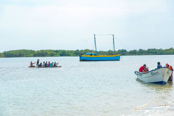 Batavia,western Madagascar, Toliara province.18 october 2023. Inhabitants Madagascar traditional fishing village fold their nets after small catch on ocean shore