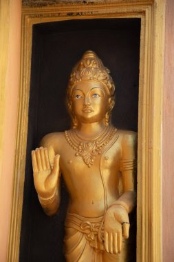 Aluthgama, Sri Lanka 07. 02. 2023 Statue in Kande Viharaya Temple in Aluthgama near Popular Tourist Center Bentota and Beruwala. beautiful curly buildings at entrance to Tempel . clipart