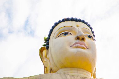 Aluthgama, Sri Lanka 07. 02. 2023 Huge - 48 m High - Sitting Buddha Statue in Kande Viharaya Temple in Aluthgama near Popular Tourist Center Bentota and Beruwala against blue sky clipart