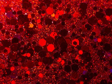 Turuncu ve kırmızı renkli bokeh ile parlayan metalik pigment tozu. makro çekim arkaplanı