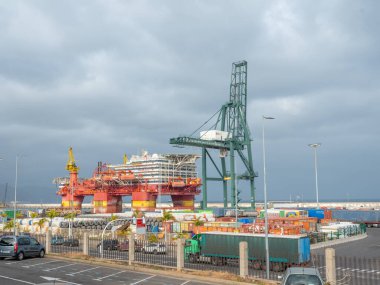 Tenerife, Canary islands, Spain 19.04 2022. Port on the island of Tenerife in Spain. Tall, powerful loading cranes ready for use clipart