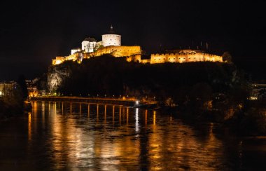 Kufstein, Austria 26.10.2022 old border town in Austria. Night streets, a small white castle high on the mountain clipart