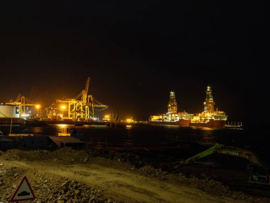 Tenerife, Canary islands, Spain 19.04 2022. Port on the island of Tenerife in Spain. Tall, powerful loading cranes ready for use clipart