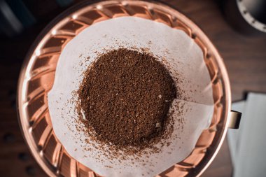 coffee powder in the dripper for make coffee filter on scales.