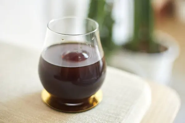 stock image black drip coffee in glass cup.selective focu