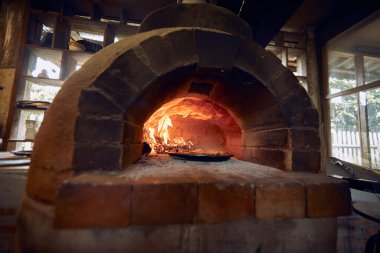 pizza traditional oven in open kitchen  restaurant clipart