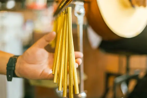 stock image Close up hand of musician play bar chimes, selective focu