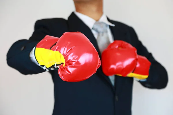 Businessman with suit and concept fight the business. Trader concept and action to fight with the business. Industry concept with businessman and acting for support presentation file.