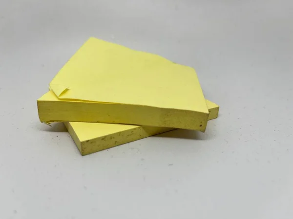 Yellow sticky note block on gray background