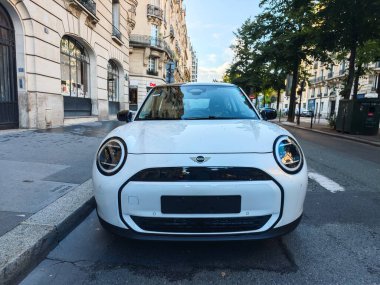 PARIS, FRANCE - September 27, 2024: New Mini Cooper electric cars clipart