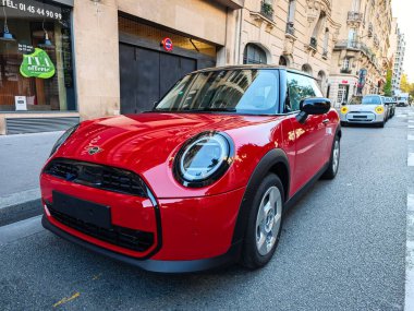 PARIS, FRANCE - September 27, 2024: New Mini Cooper electric cars red clipart