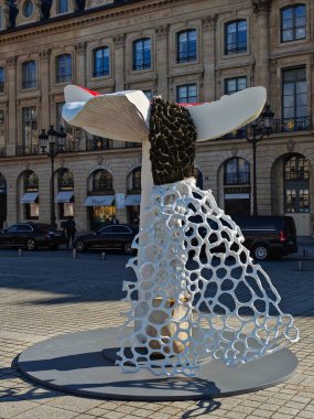 PARIS, FRANCE - October 14, 2024: Art Basel Paris 2024 fair: giant mushrooms decorate Place Vendme. Original installation by artist Carsten Hller clipart