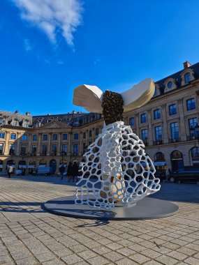 PARIS, FRANCE - October 14, 2024: Art Basel Paris 2024 fair: giant mushrooms decorate Place Vendme. Original installation by artist Carsten Hller clipart