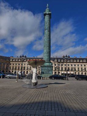 PARIS, FRANCE - October 14, 2024: Art Basel Paris 2024 fair: giant mushrooms decorate Place Vendme. Original installation by artist Carsten Hller clipart