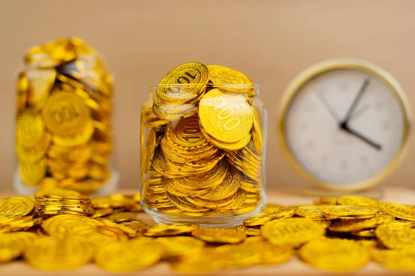Gold Coins Save gold coins in glass jars. Concept