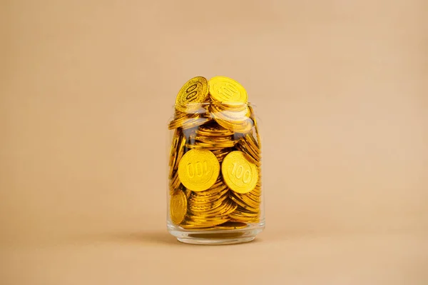 Gold Coins Save gold coins in glass jars. Concept