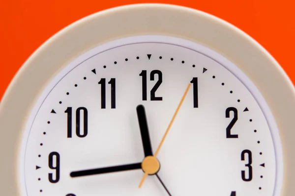 alarm clock time strategy Work plan with time. Orange background. Working with time. Punctuality. Keep time. Value time concept.