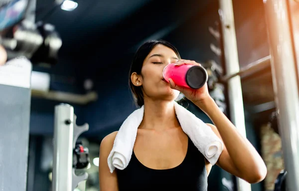 Drink water after exercising and sweating from strenuous exercise. tiredness from exercise