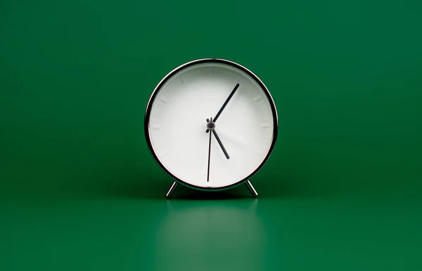 Alarm clock, standing still time, rules of time and how time works, studio photography