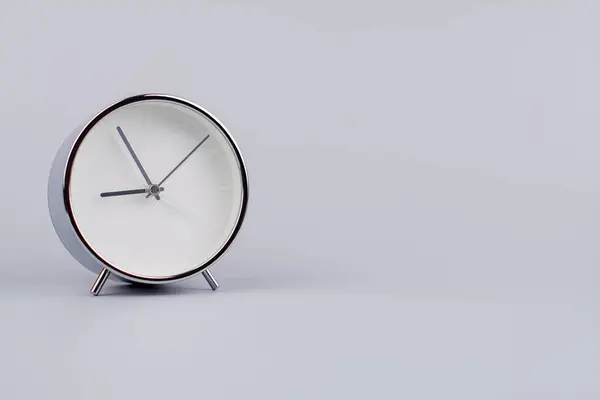 Time and work of every day Photo of a modern alarm clock in a studio