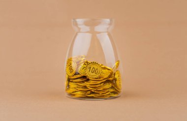 Saving gold in a glass bottle creates financial security and wealth. Income from investment, gold coins. clipart