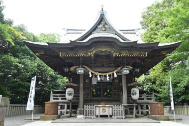 The shrine 'Shirahata-jinja' where the Japanese warlord Yoshitsune Minamoto is enshrined. There are statues of Yoshitsune Minamoto and his retainer Benkei. Fujisawa City, Kanagawa Prefecture, Japan. clipart