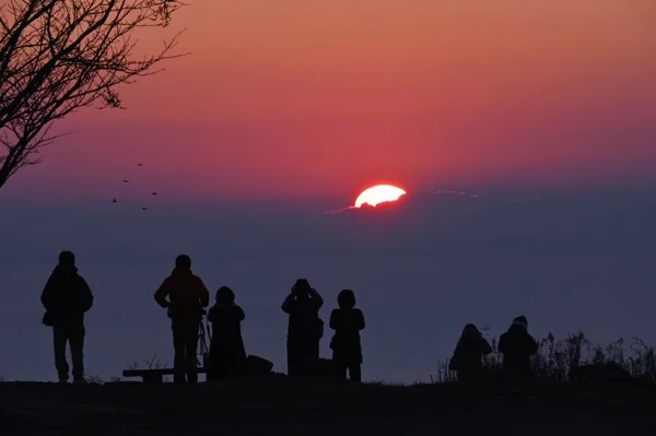 The first sunrise of the new year. Traditional cultural events for Japanese people who welcome the new year are going to a Shinto shrine for New Year\'s visit and watching the first sunrise of the year.