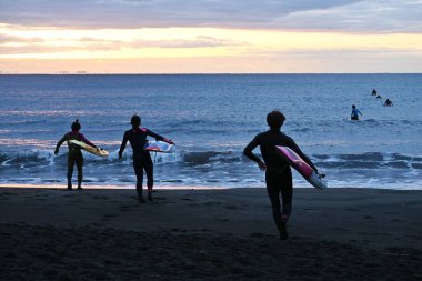 A view of young lifesavers practicing on a winter morning. clipart