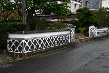 Japan Travel. Traditional Japanese wall pattern, called Namako Wall in Japan. A wall covered square tiles jointed with raised plaster. Matsuzaki Town, Shizuoka Prefecture, Japan. clipart