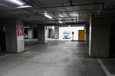 A scene of a paid parking lot for cars in Japan. The parking lot's automatic gate system. clipart